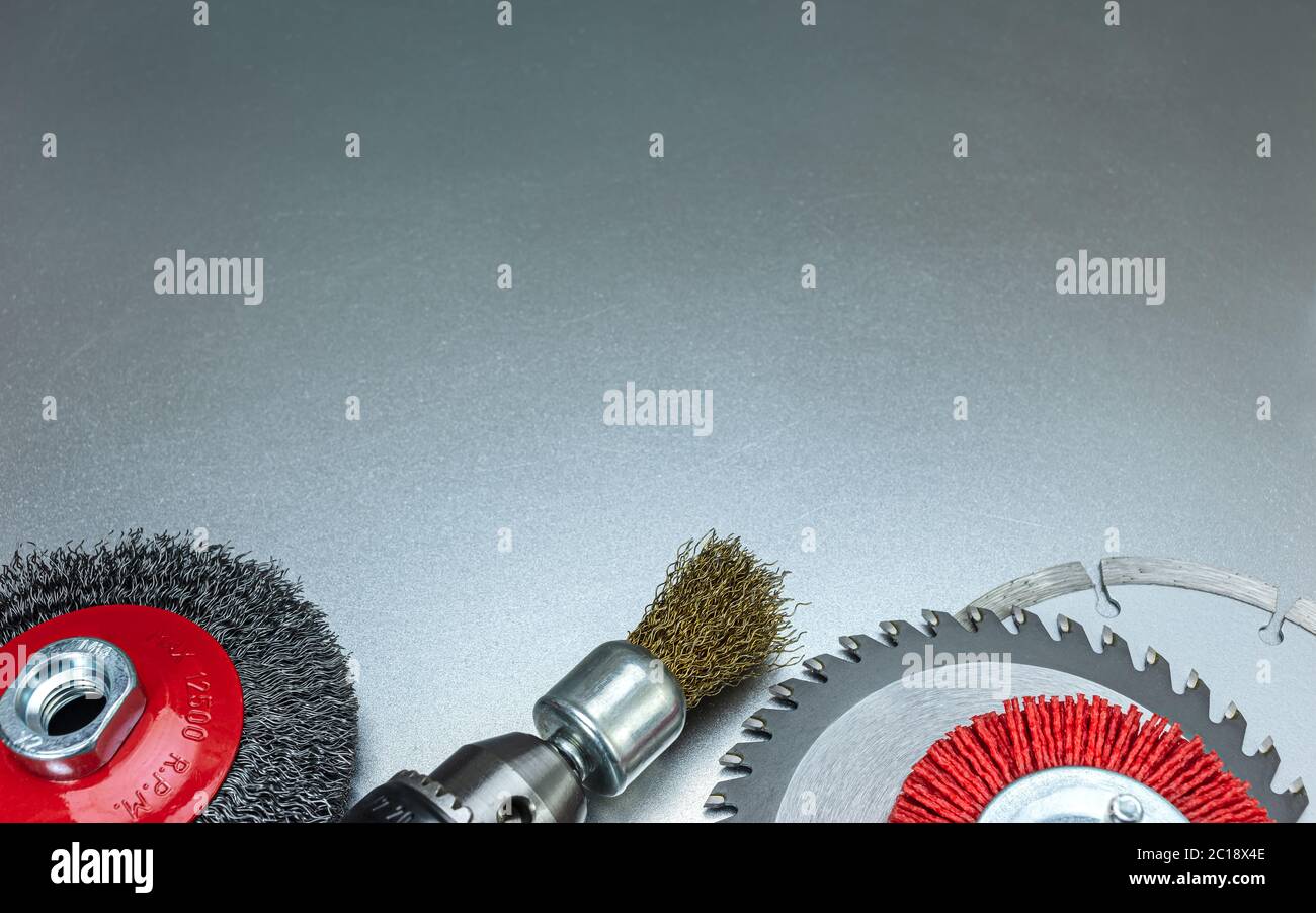 cutting disc with different rotary wire brush disks on grey metal