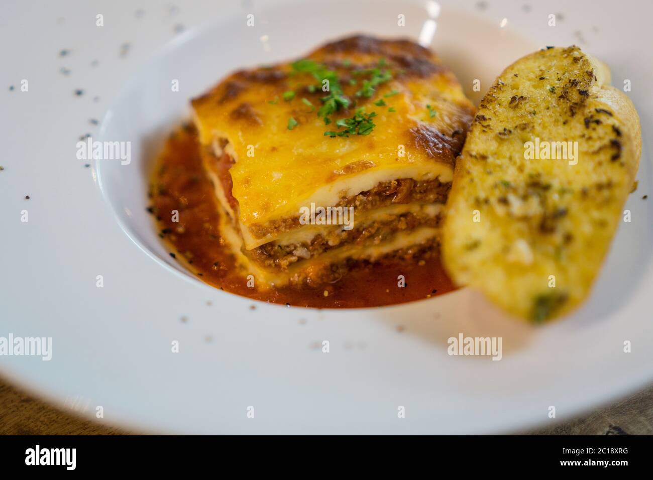 Tasty serving of traditional Italian lasagne with spicy tomato based