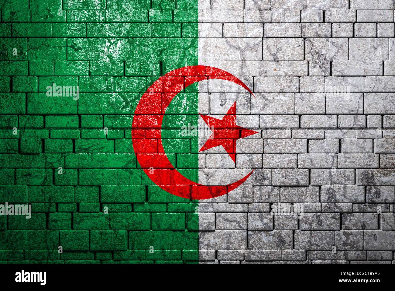 National flag of Algeria on brick wall background.The concept of ...