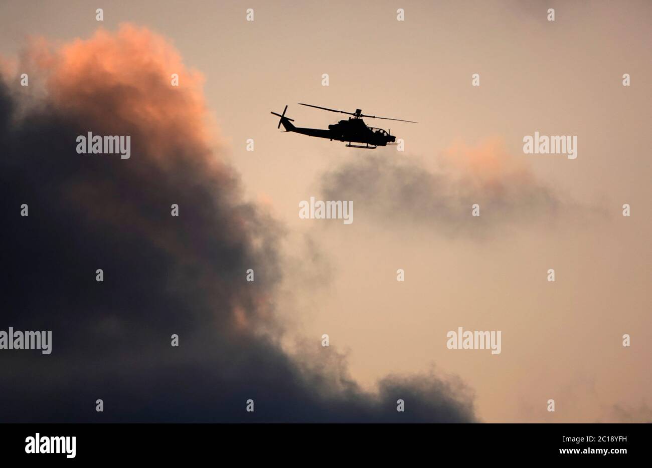 San Diego, California, USA. 14th June, 2020. A U.S. Marine Bell AH-1Z Viper, a twin-engine attack helicopter flies along the San Diego coast at Sunset. Credit: KC Alfred/ZUMA Wire/Alamy Live News Stock Photo