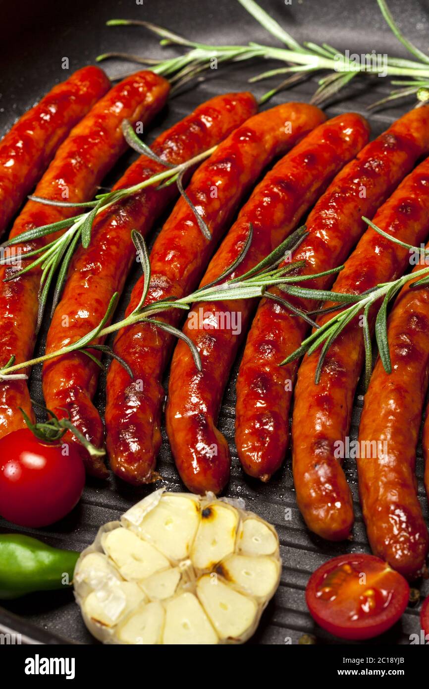 Closeup of Wiener Sausages in a pan Stock Photo