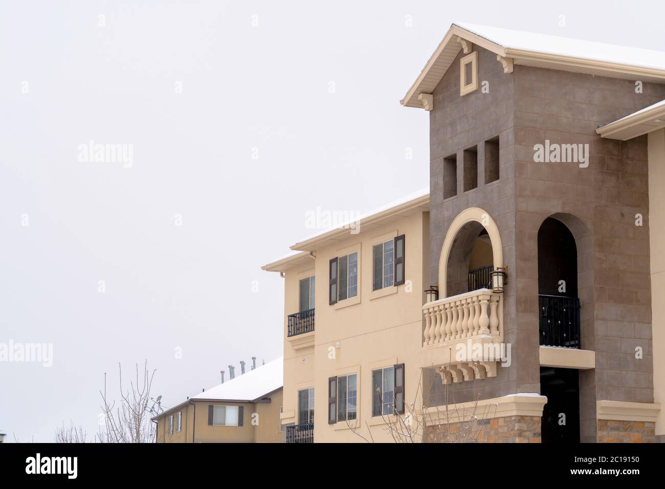Fresh Look at Beautiful Apartments With Arched Balcony Stone Wall And Snowy Roof