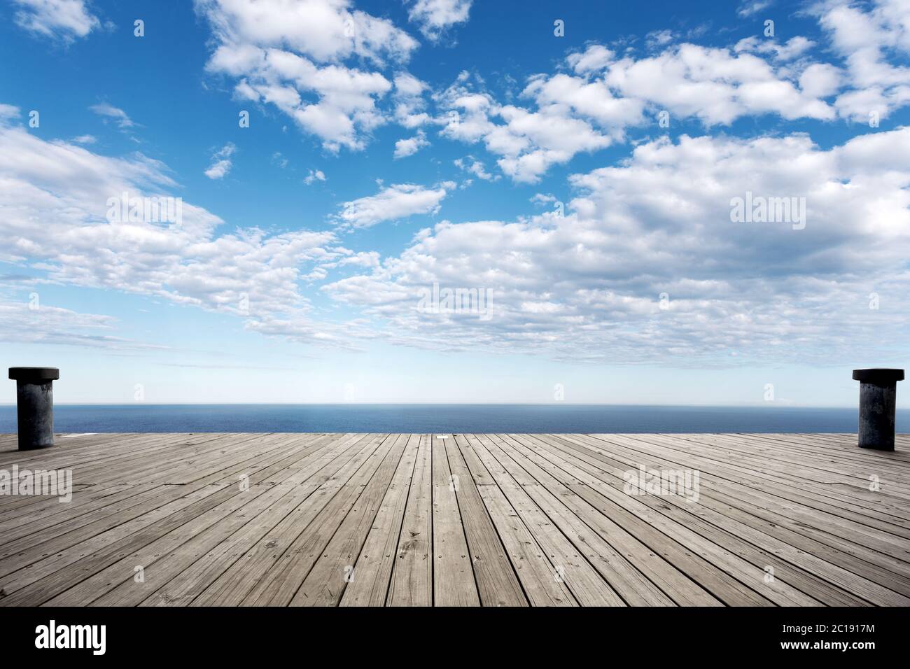empty wooden floor with beautiful sea in blue cloud sky Stock Photo