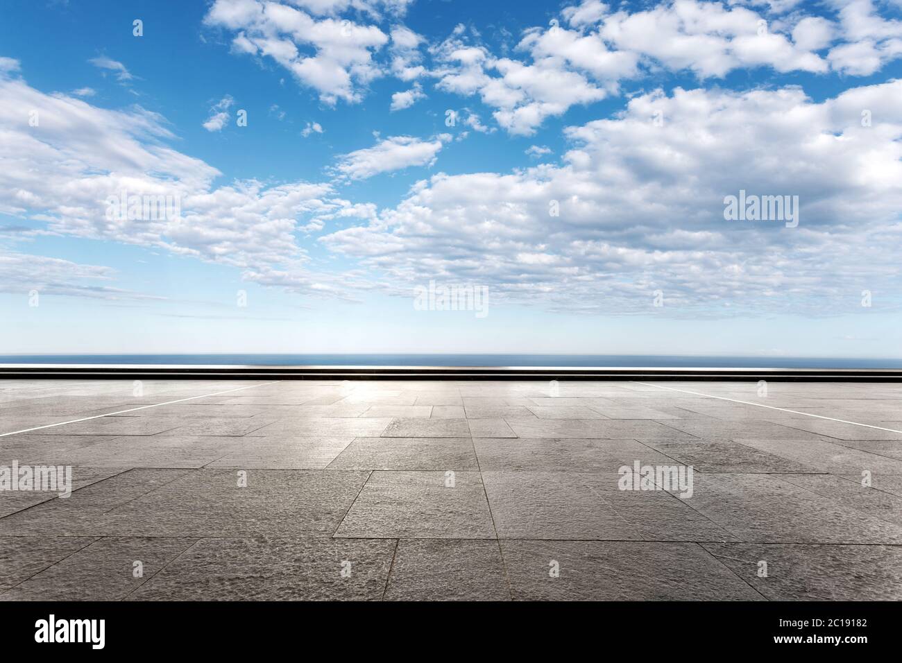 empty marble floor with beautiful sea in blue cloud sky Stock Photo