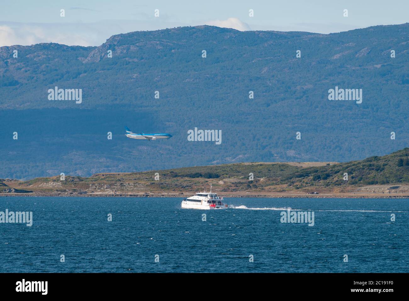 Airplane on approach to Ushuaia International Airport, Argentina Stock Photo
