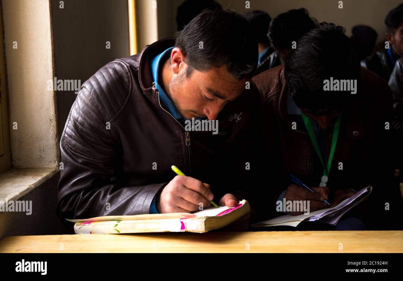 Students in classrooms in  Students in a community run college in Gupis Valley in Gilgit Baltistan. Stock Photo