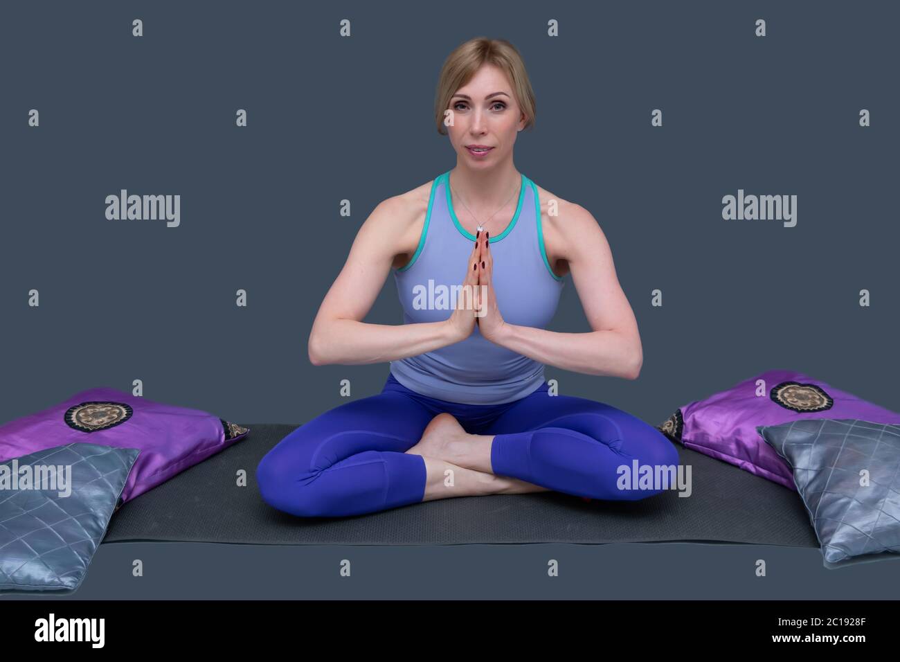 Health and personal care concept. White beautiful woman is doing yoga exercises. Stock Photo