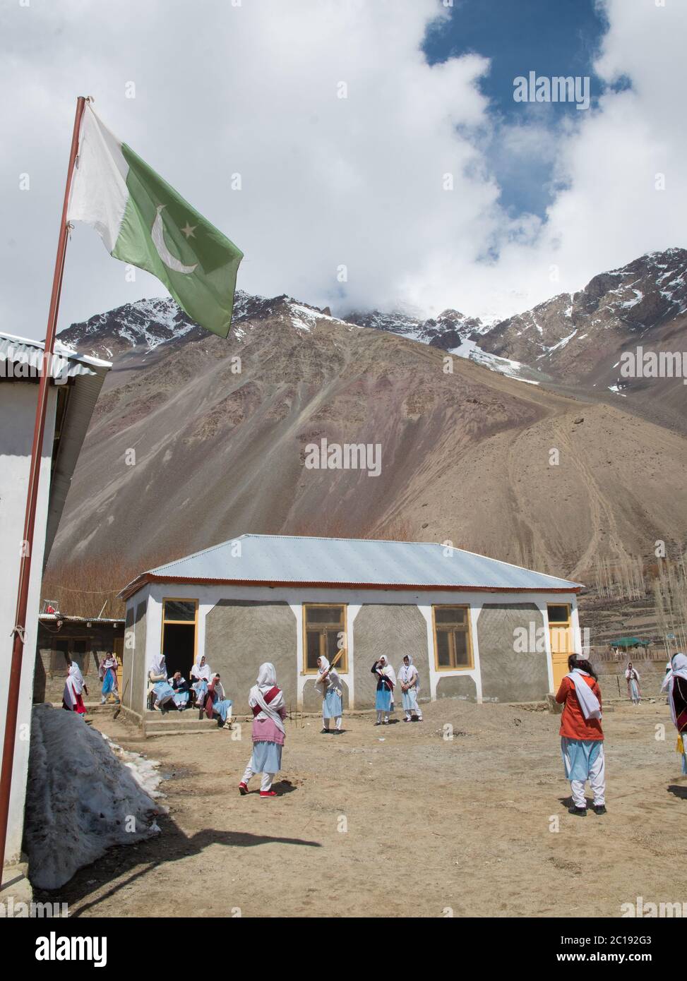Students play volleyball and cricket during their break in a college in Gupis Valley in Gilgit Baltistan. Stock Photo