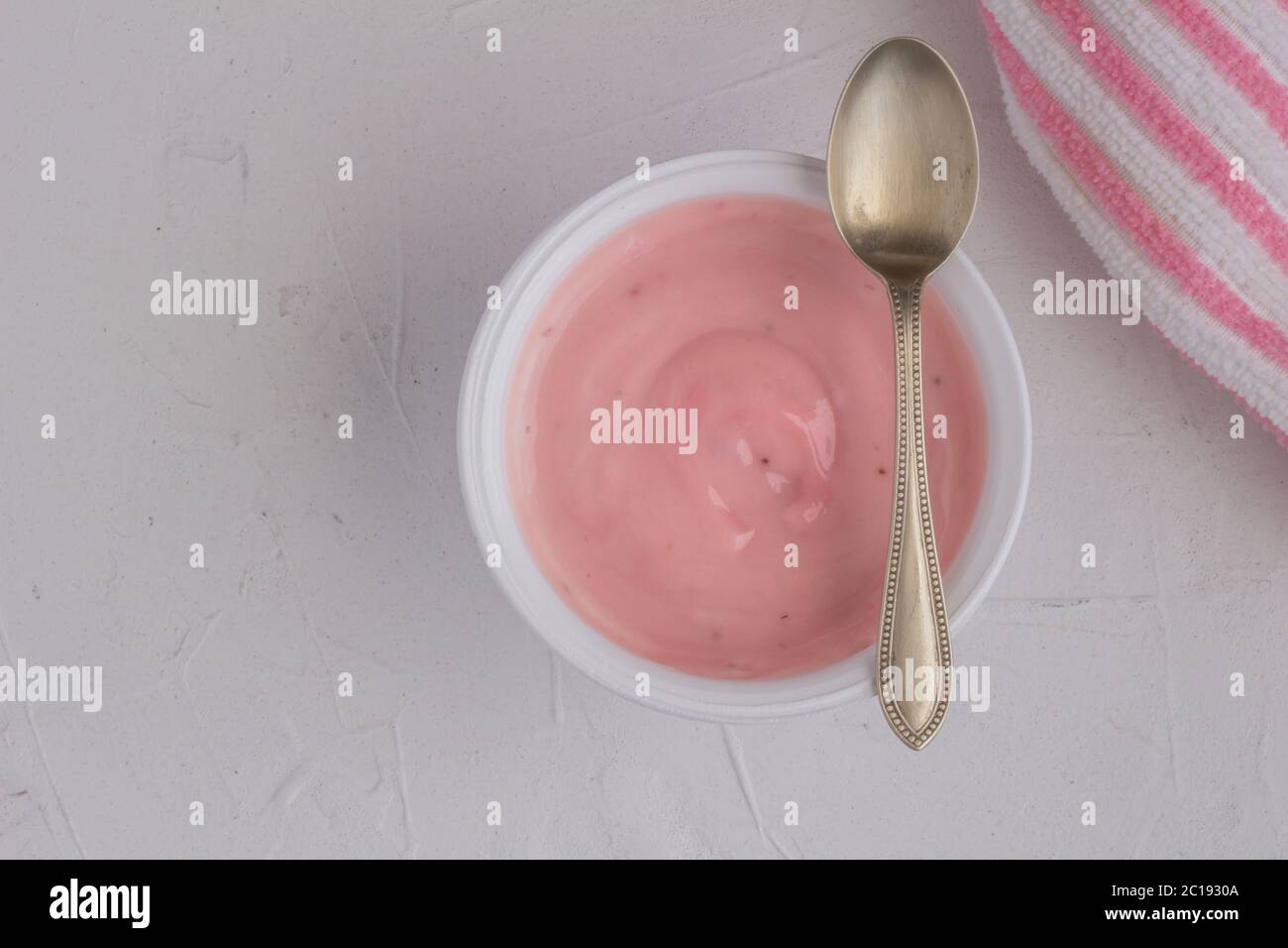 Healthy strawberry fruit flavored yogurt with natural coloring in