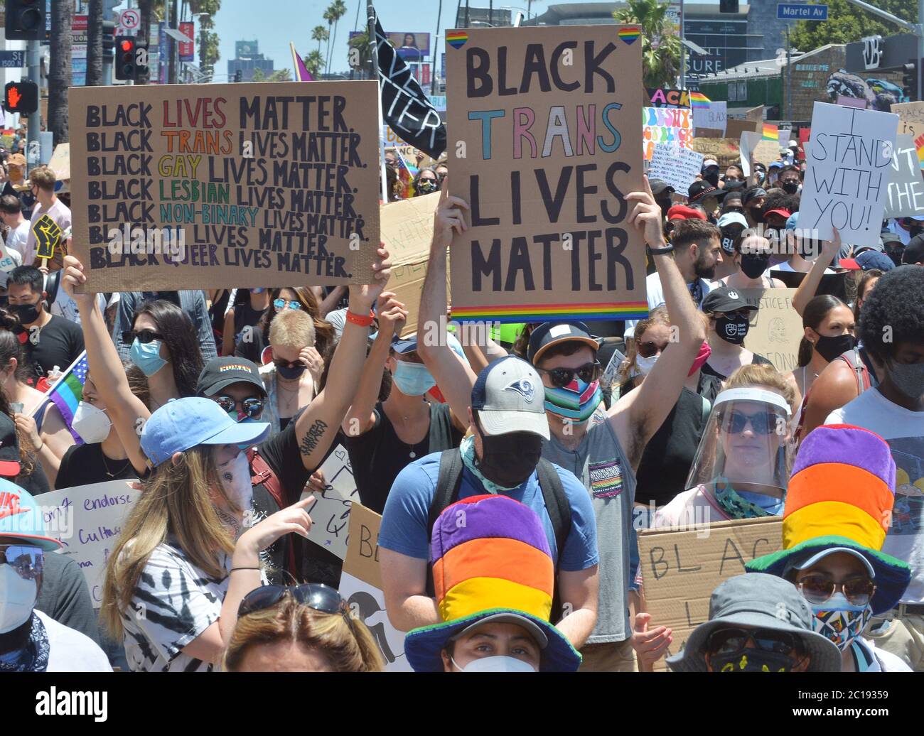 Los Angeles, United States. 15th June, 2020. Thousands of 'All Black Lives Matter' demonstrators march to West Hollywood after converging on Hollywood Boulevard in front of the TCL Chinese Theatre denouncing racial injustice and supporting LGBTQ rights, as protests continued nationwide on Sunday, June 14, 2020. An estimated 20,000 people turned out Sunday, Flag Day, for an anti-racism solidarity march from Hollywood to West Hollywood, the city originally set to host the LA Pride Parade before it was canceled due to the coronavirus. Photo by Jim Ruymen/UPI Credit: UPI/Alamy Live News Stock Photo