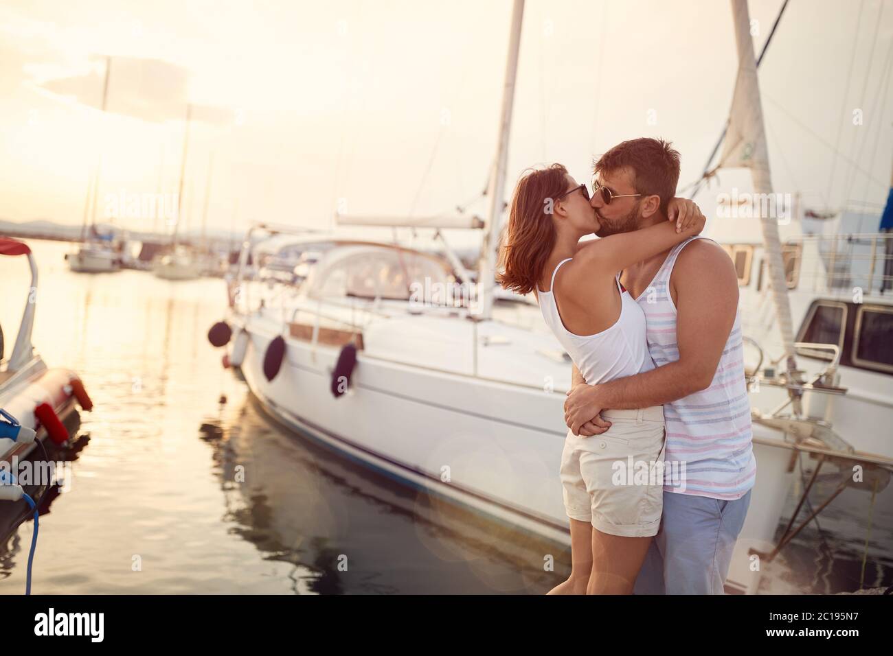 Couple kissing on dock hi-res stock photography and images - Alamy