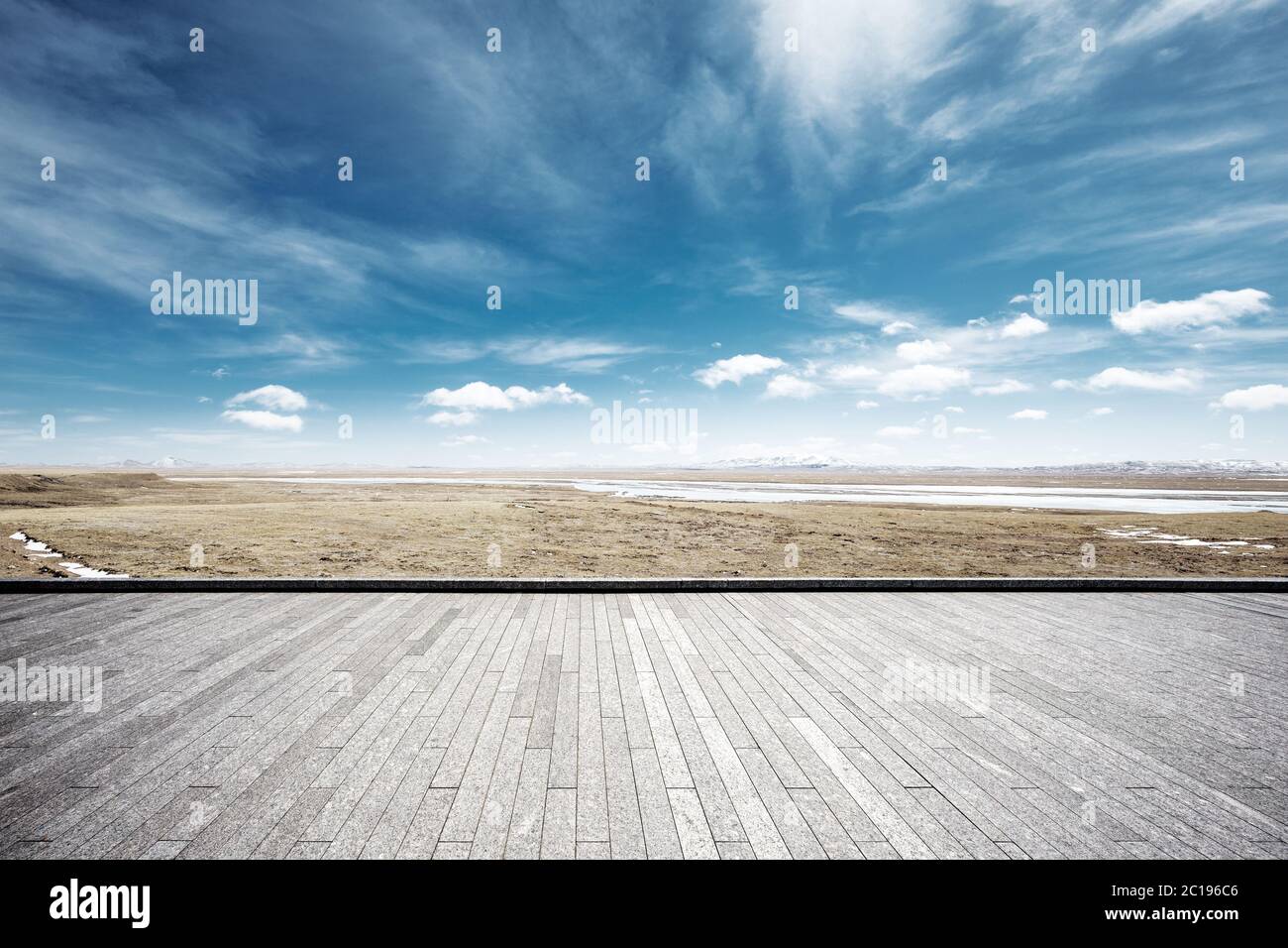 empty brick floor with snow mountains Stock Photo