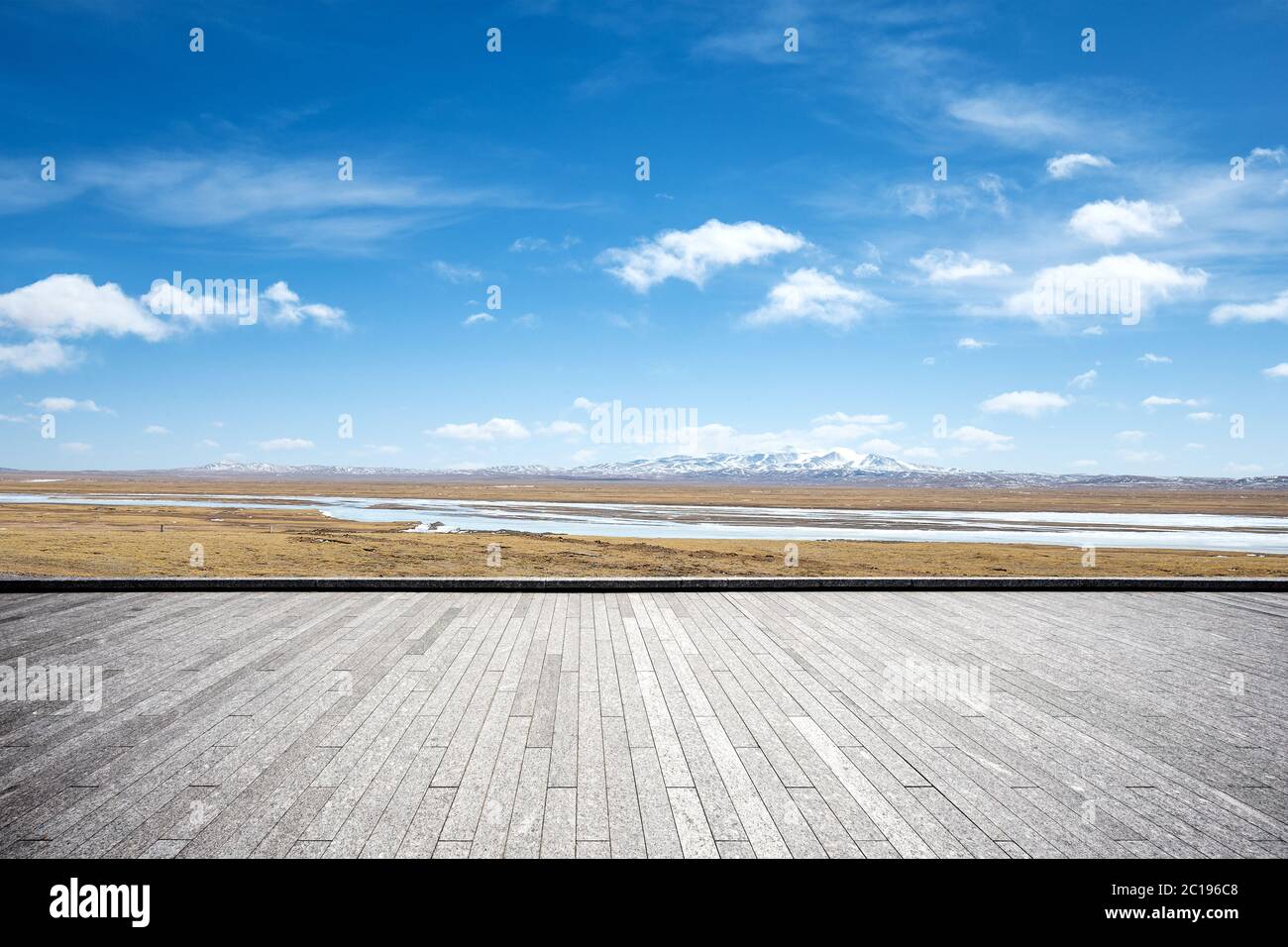 empty brick floor with snow mountains Stock Photo