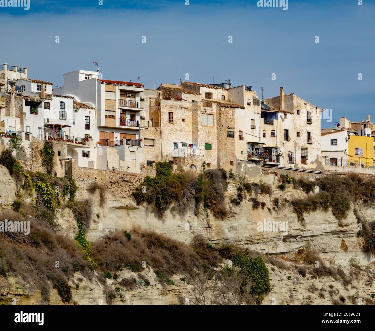 Residential buildings on the edge of high rock in Sorbas, Spain Stock Photo