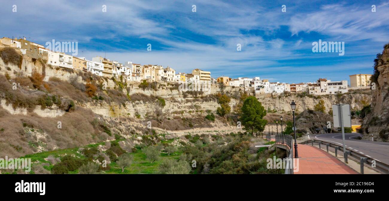 Residential buildings on the edge of high rock in Sorbas, Spain Stock Photo