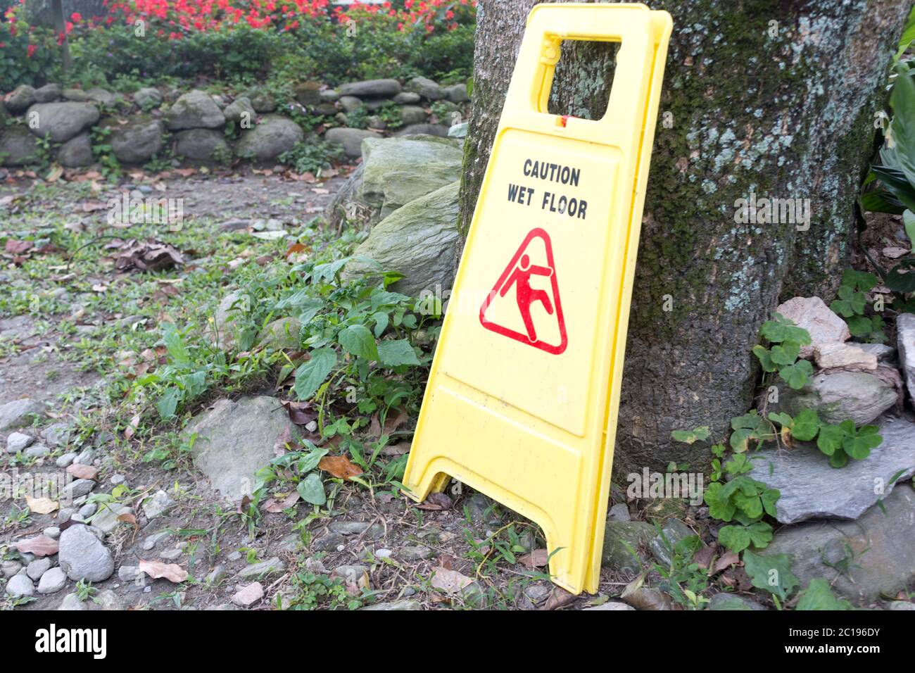 yellow plastic wet floor sign Stock Photo