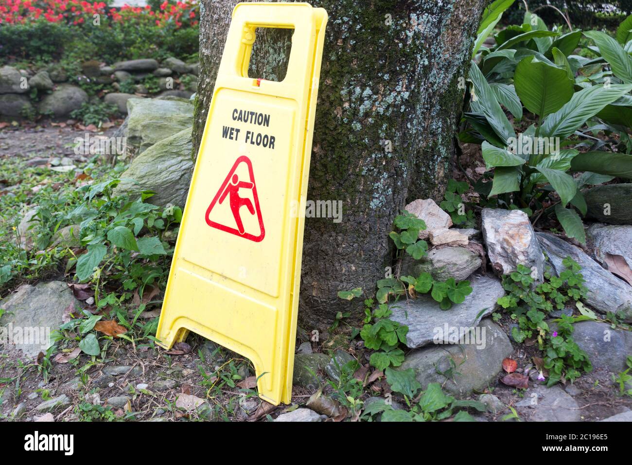 yellow plastic wet floor sign Stock Photo