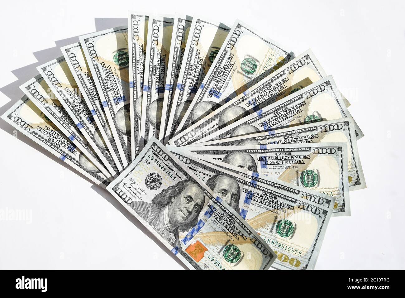 Fan of one hundred dollar bills isolated on white background. Many