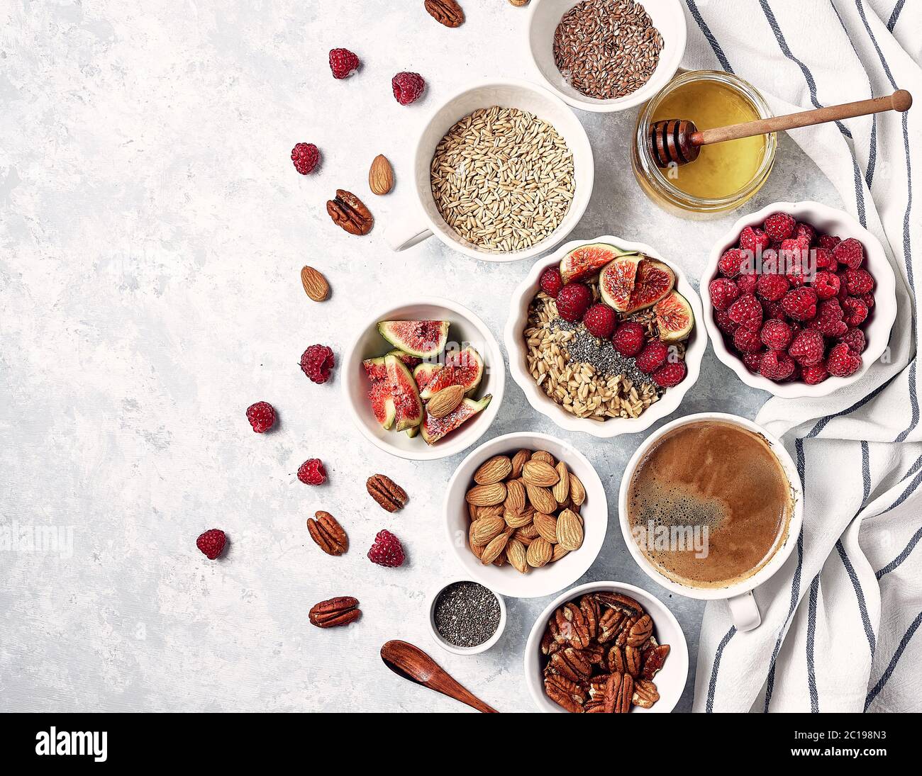 Healthy breakfast, top view. Oatmeal porridge with raspberries, figs