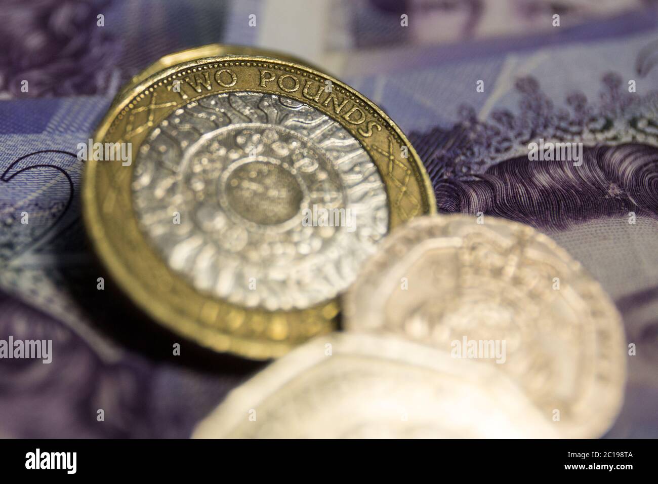 In this photo illustration The British two pound (L2) coin of the pound sterling seen displayed. Stock Photo