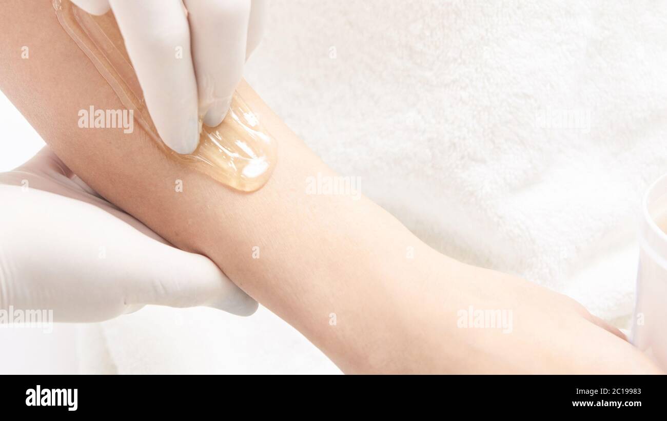 Depilation spa procedure. Woman hair remove waxing. Epilation sugaring