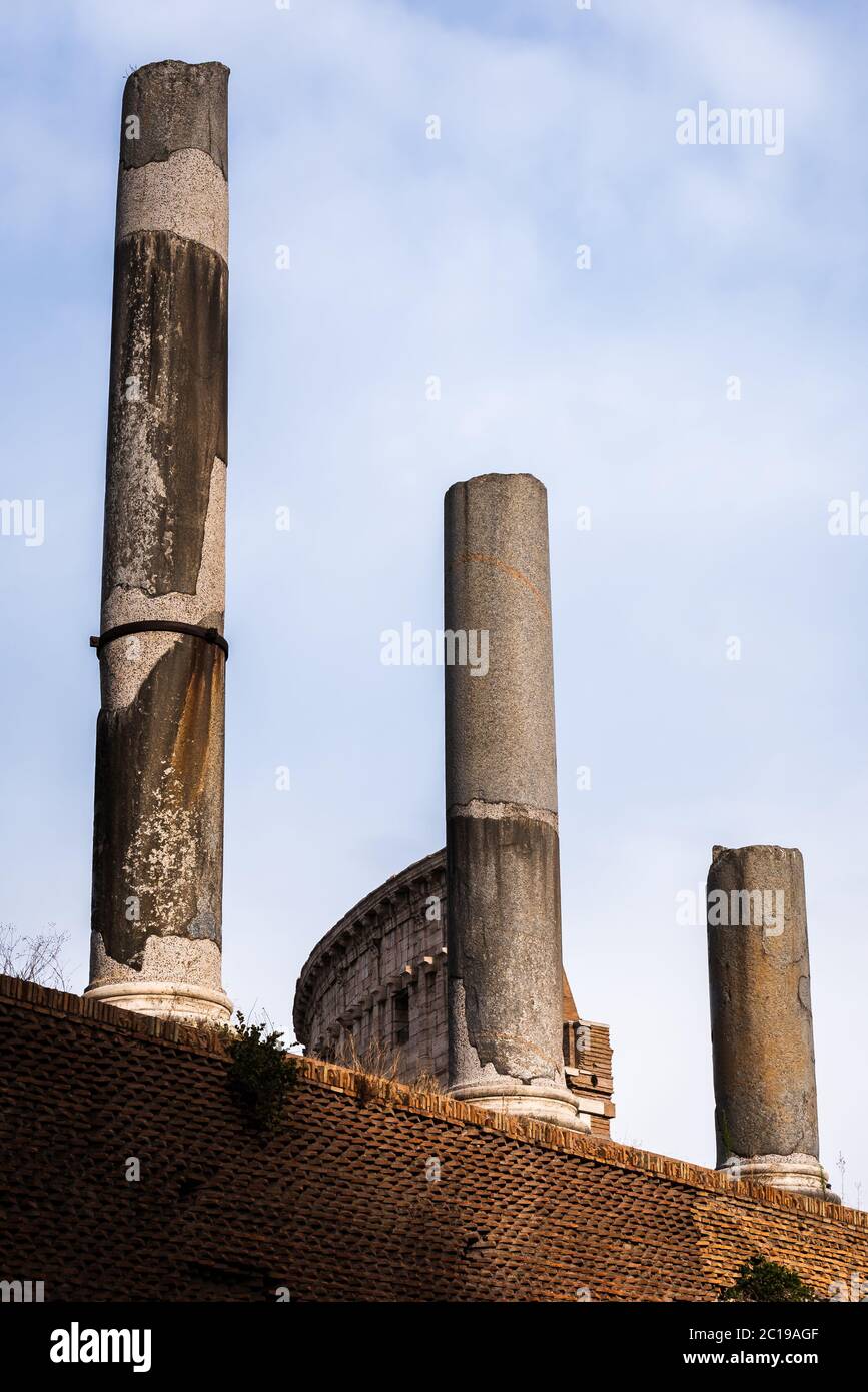 Ancient columns of the Sacred Way in front of the Colosseum in Rome, Italy Stock Photo