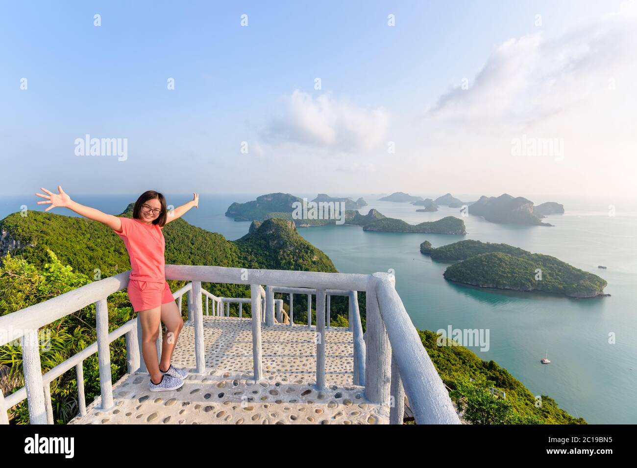 Woman tourist on peak viewpoint of island Stock Photo