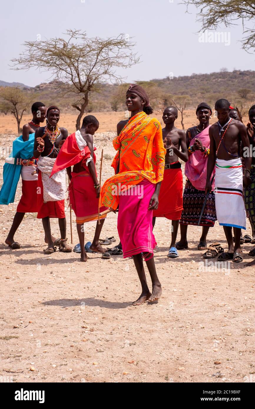 Maasai men wearing traditional attire, members of the Samburu tribe, in a traditional dance, in Samburu National Reserve. Kenya. Africa. Stock Photo