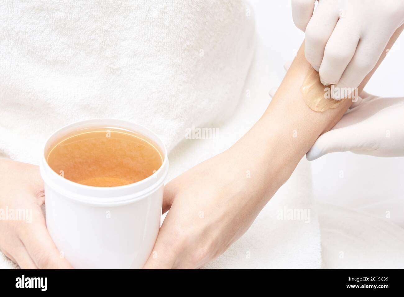 Depilation spa procedure. Woman hair remove waxing. Epilation sugaring