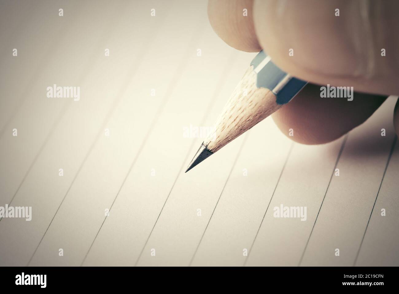 Male hand writing in notebook Stock Photo