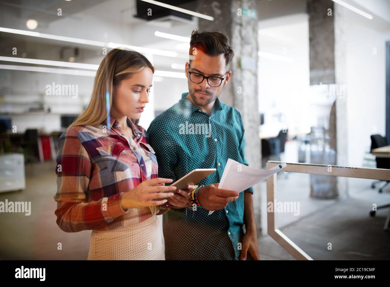 Creative professional designers brainstorming in office. Business