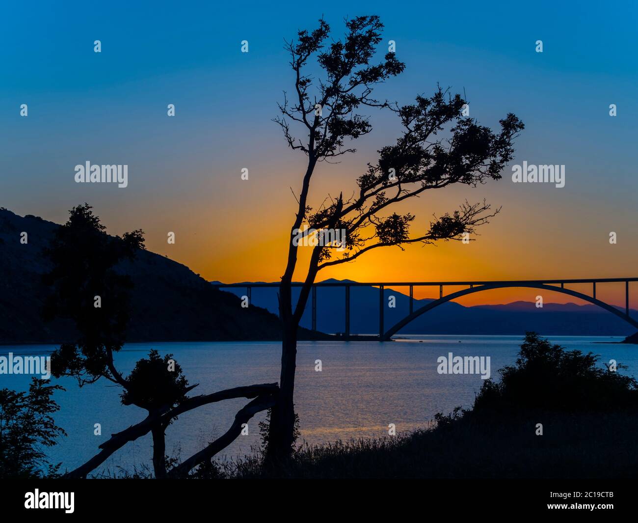 Sunset dusk landscape bridge mainland to island Krk Croatia Stock Photo