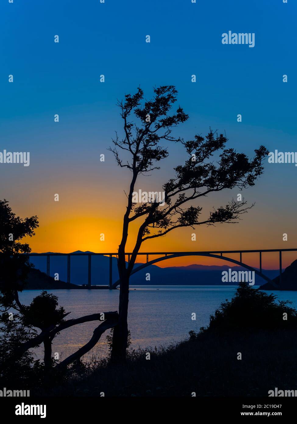 Sunset dusk landscape bridge mainland to island Krk Croatia Stock Photo