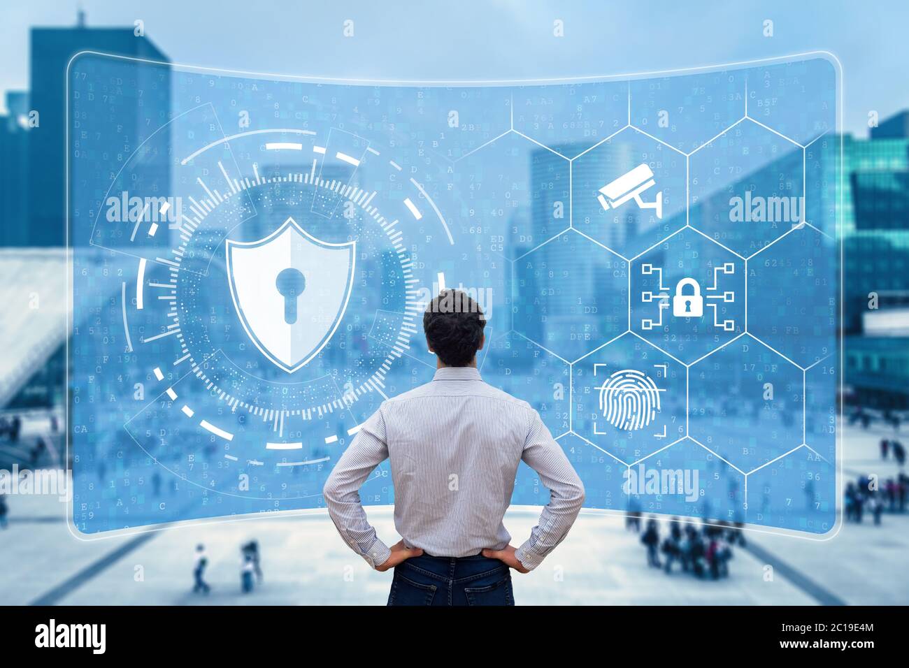 Cyber security and network protection. Cybersecurity expert working with secure access on internet. Concept with icons on screen and office buildings Stock Photo