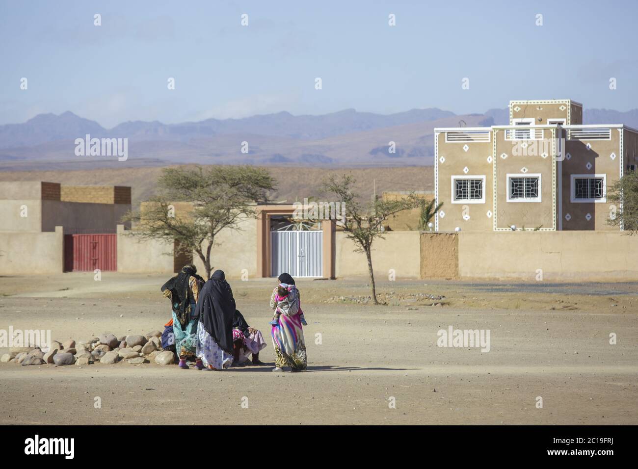 Tinghir, Morocco - February 27, 2016: Women sitting outside house Stock Photo