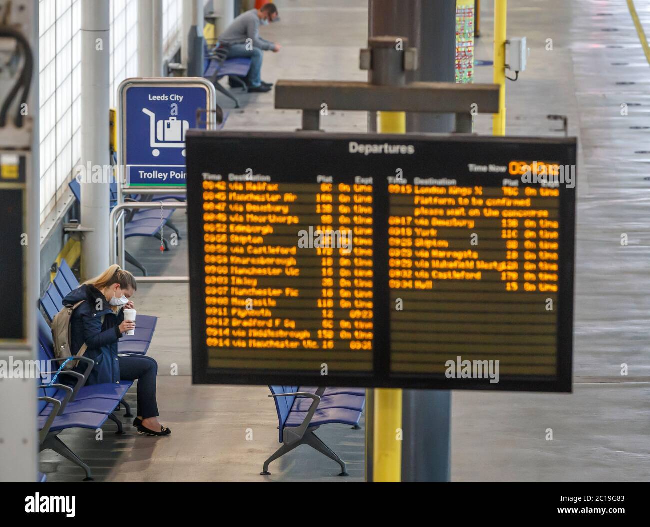 Passengers wearing face masks at Leeds railway station as face coverings become mandatory on public transport in England with the easing of further lockdown restrictions during the coronavirus pandemic. Stock Photo