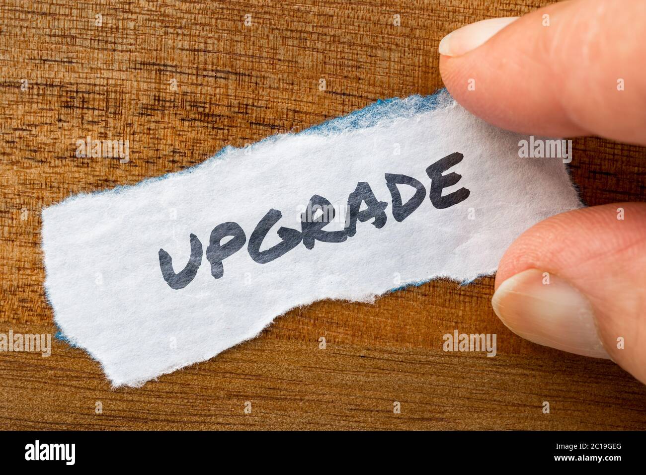 Upgrade concept and theme written on old paper on a grunge background Stock Photo
