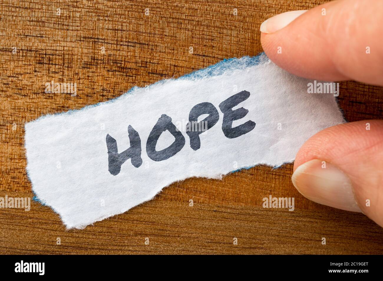 Hope concept and theme written on old paper on a grunge background Stock Photo