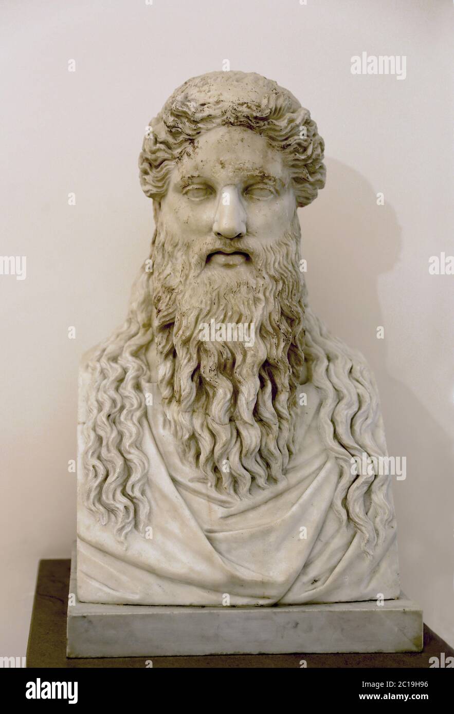 Head of Dionysus set in a modern herm. 2nd century AD. Roman work, marble,  copy of a Greek original. Naples Archaeological Museum. Stock Photo