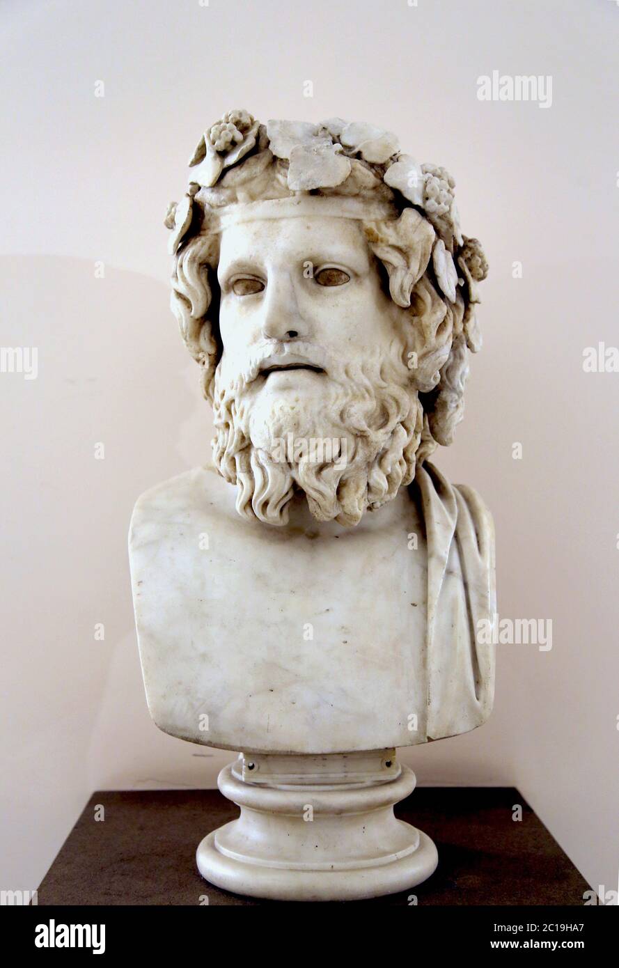 Bearded  Dionysus, crowned with grapes and leaves. 2nd century AD. Roman marble bust. Archaeological Museum of Naples, Italy. Stock Photo