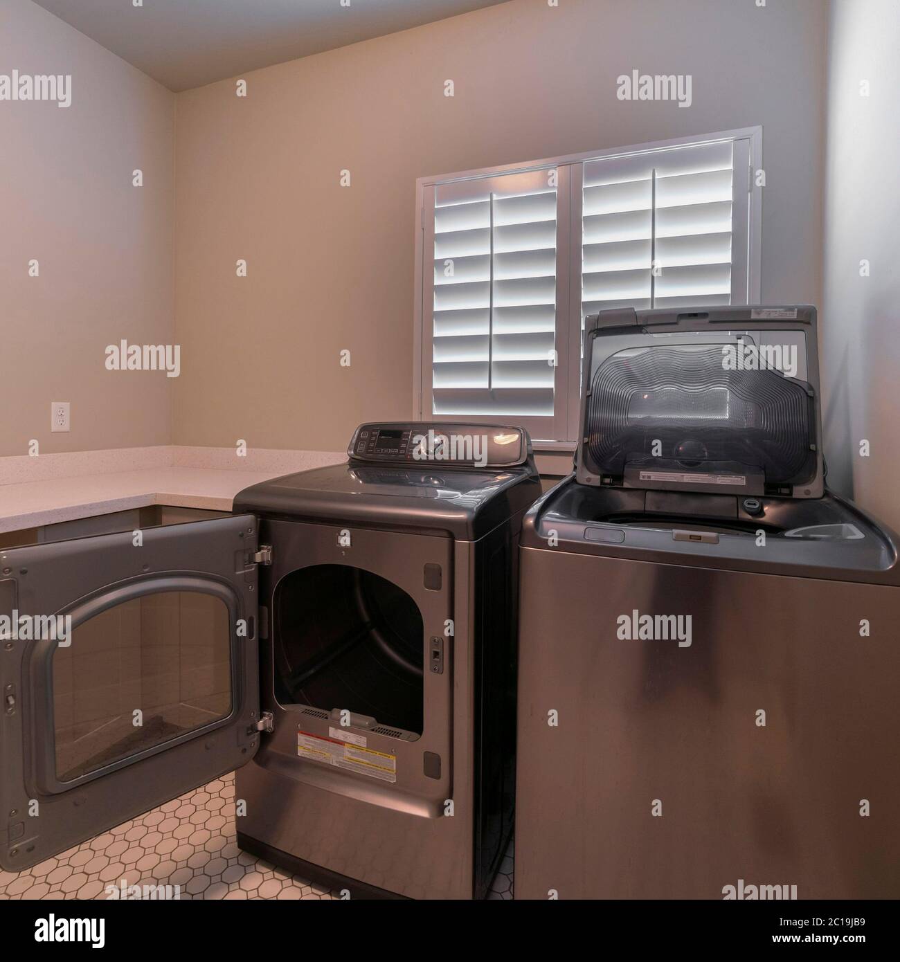 Square Electrical appliances in a laundry room interior Stock Photo Alamy
