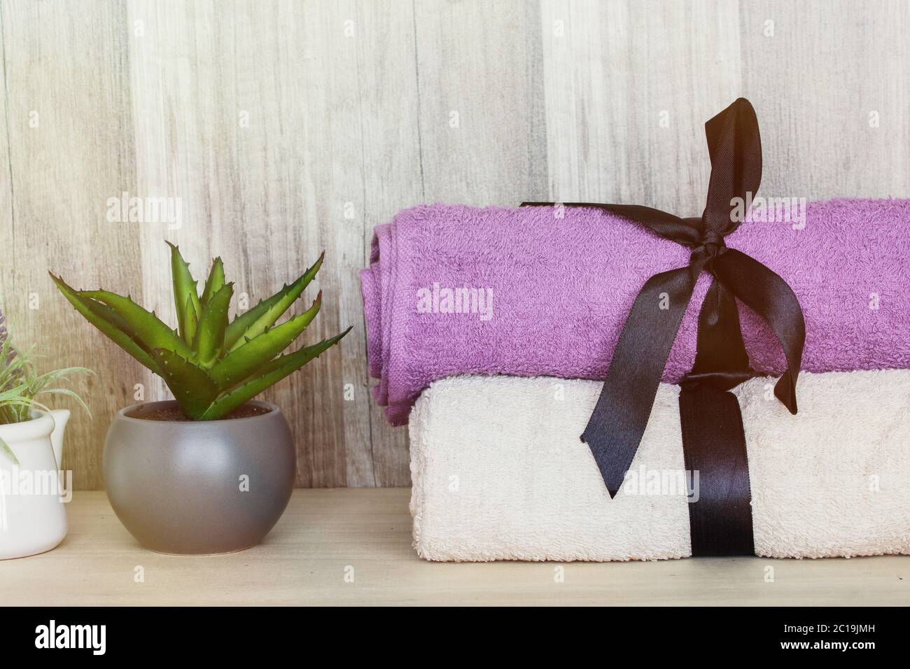 Towels with a decorative plant. Beauty Spa Health and Wellness concept. Stock Photo