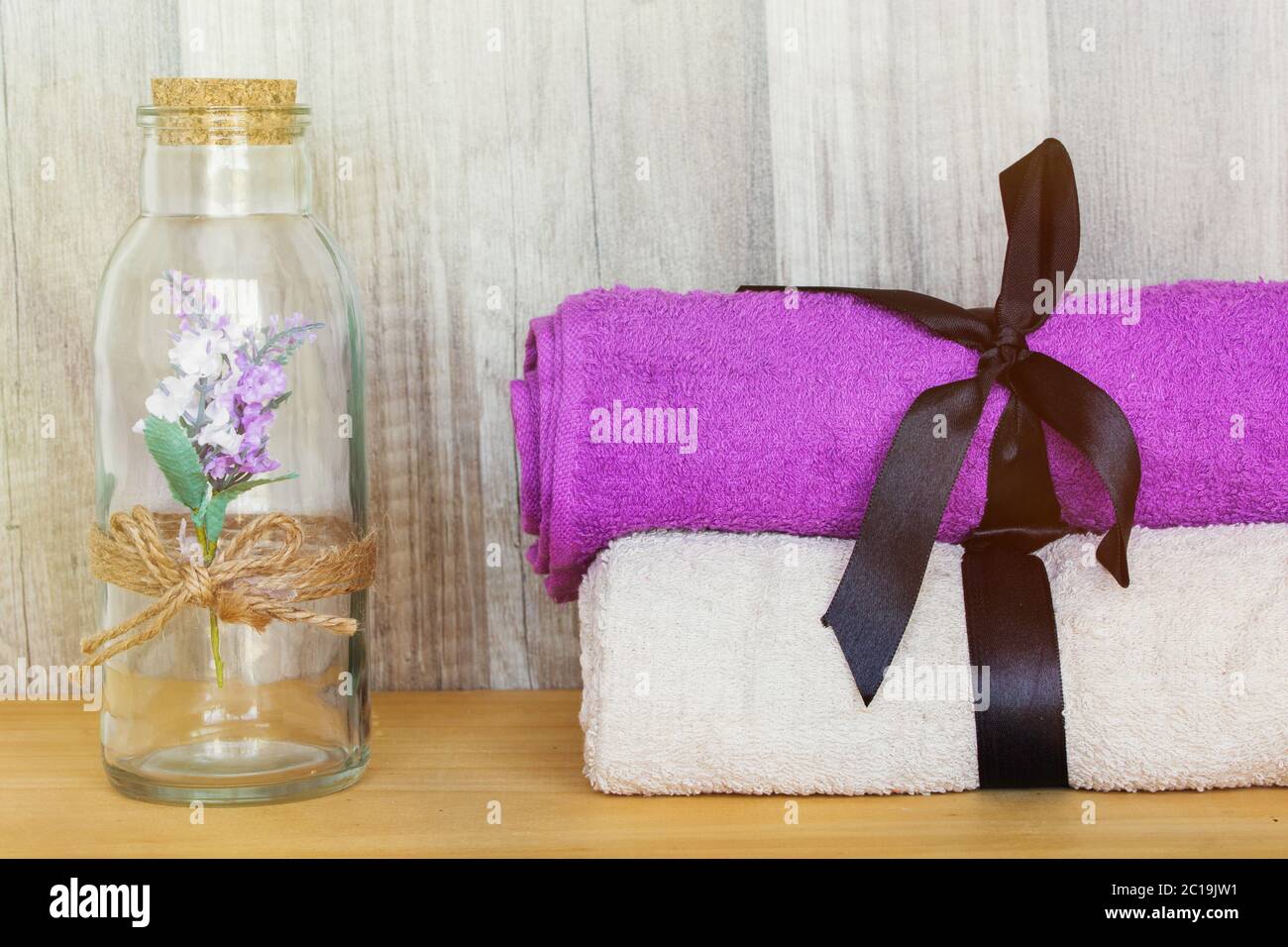 Towels with decorative bottle. Beauty Spa Health and Wellness concept. Stock Photo