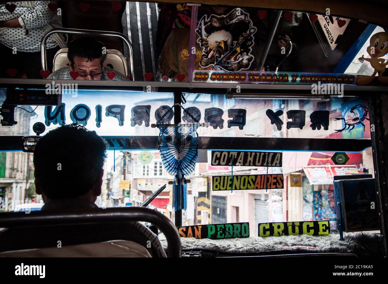 Traditional bolivian bus in the city of La Paz. Bus driver. Bolivia. Stock Photo