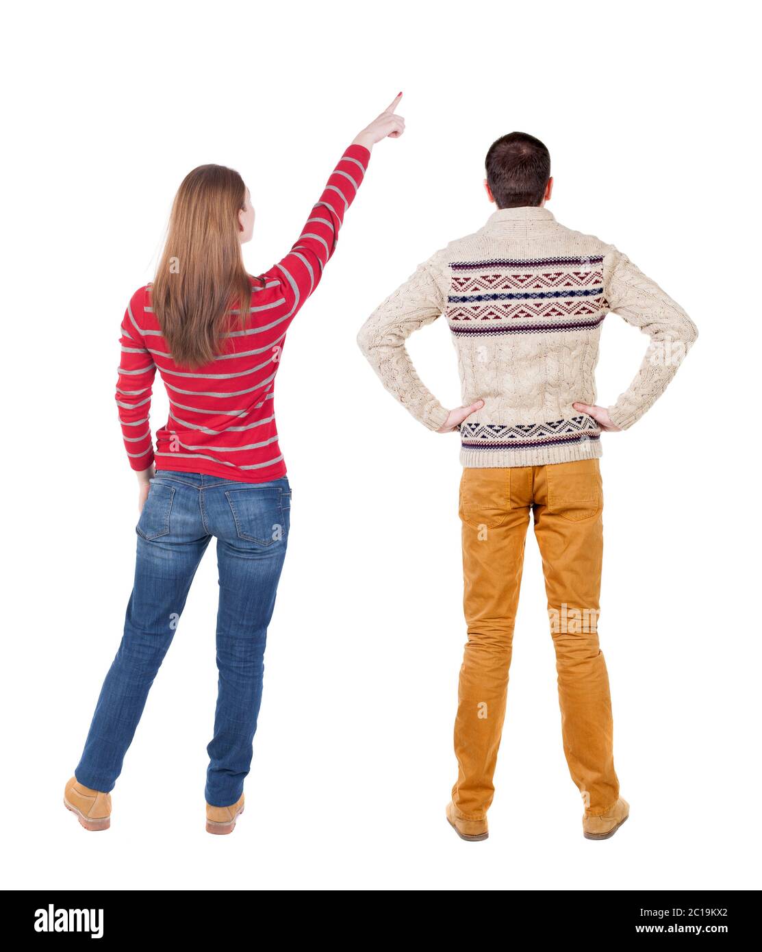 Back view of couple in sweater pointing. Rear view people collection ...