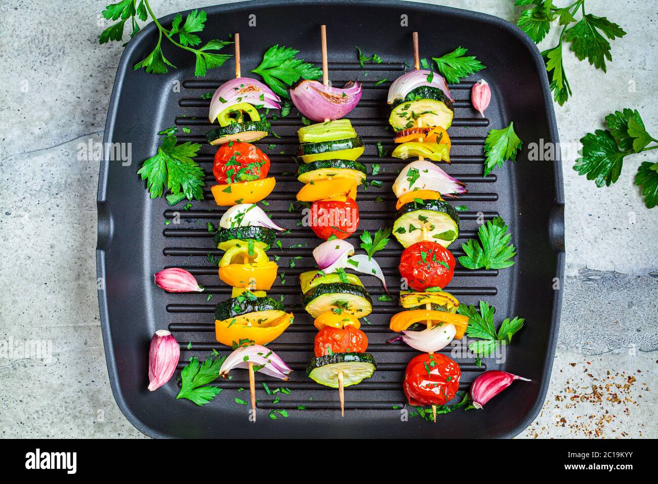 Vegetarian grill skewers, tomato, yellow and green zucchini, tofu, feta, onion and champignon, Argentinian chimichurri Stock Photo - Alamy