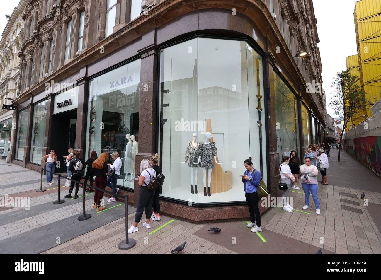 People queue at the entrance of Spanish fashion chain Zara in Belfast, as  the shop is due reopen this morning as lockdown eases Stock Photo - Alamy