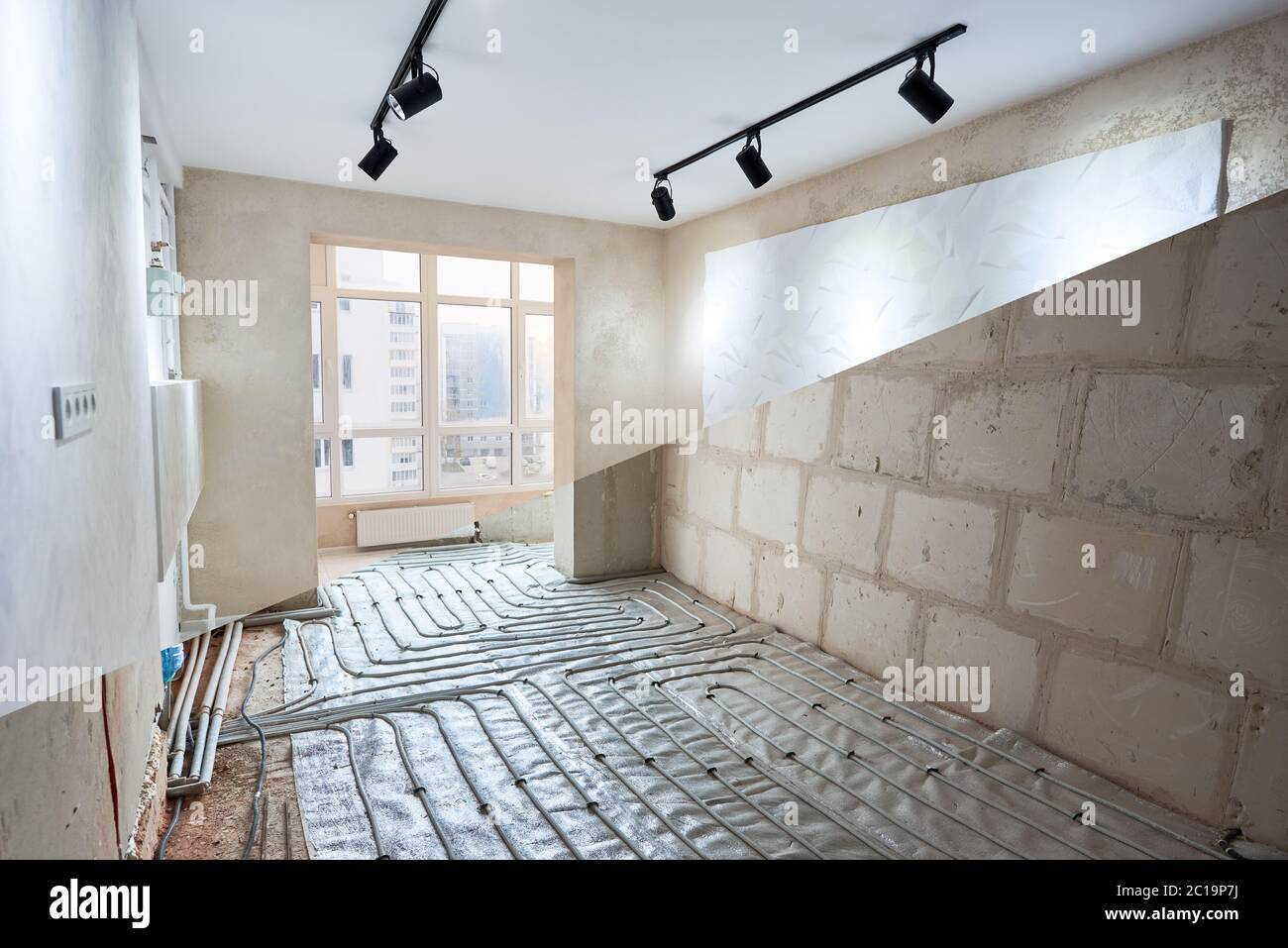 Comparison of new renovated room with large window and old place with underfloor heating pipes. Modern apartment before and after restoration. Concept of home renovation and refurbishment. Stock Photo