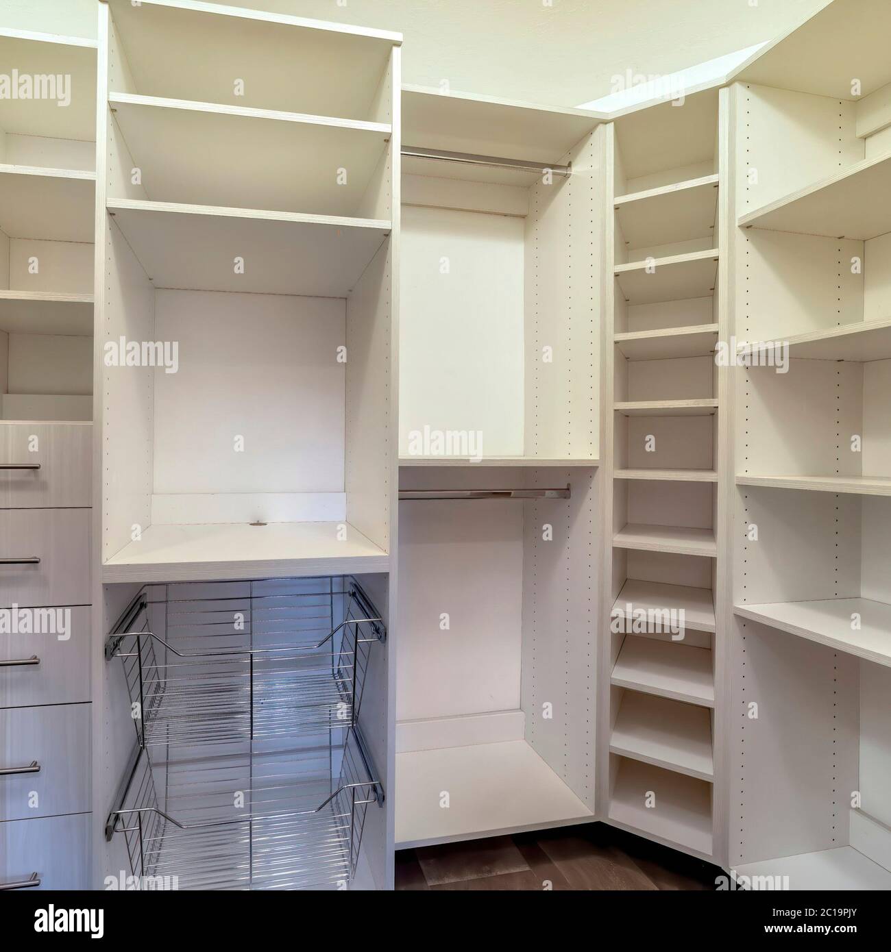 Square crop Walk in closet interior with shelves hanging rods drawers