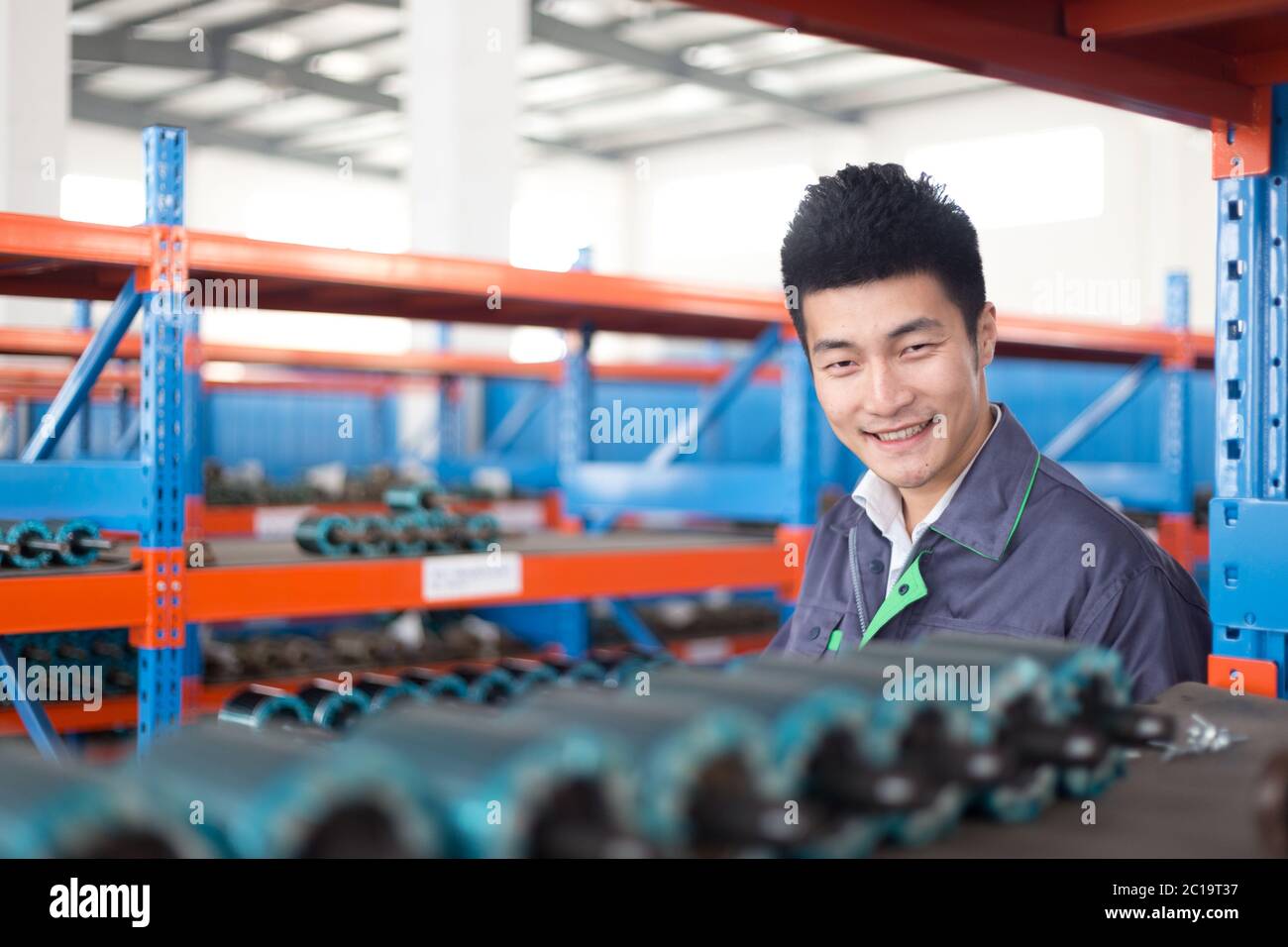 young asian man works in workshop Stock Photo